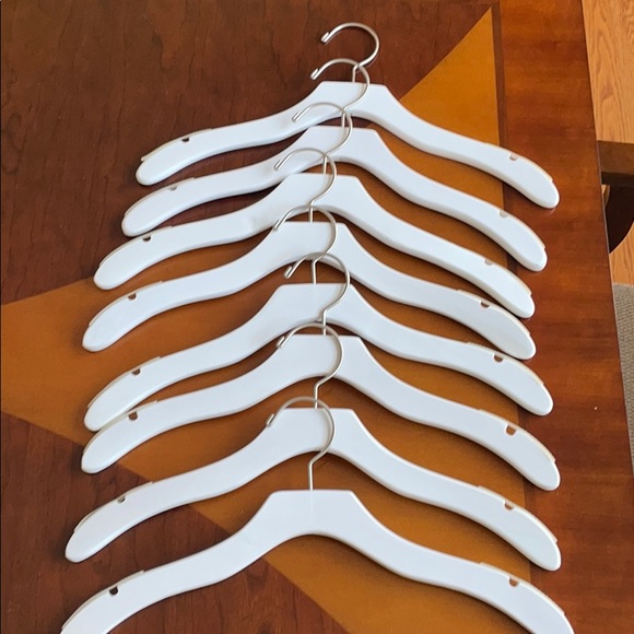 White wooden shirt hangers